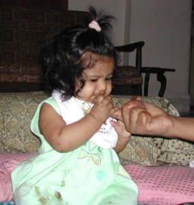 Actual photo of baby's first fingerful of ragi porridge.