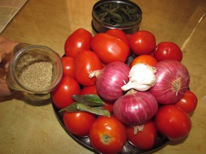 Soon to be tomato soup: Tomato, onion, garlic, basil, ajwain.  Not pictured:  salt, lemon and oil.