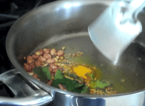 Sautee spices and add to cooked korra (foxtail millet)