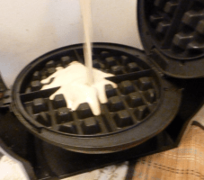 Pour batter into all four quadrants of the waffle iron