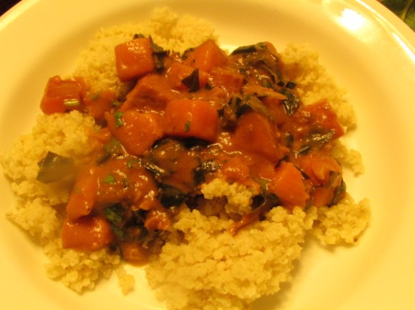 Stew made of collard green and sweet potato served with millet.