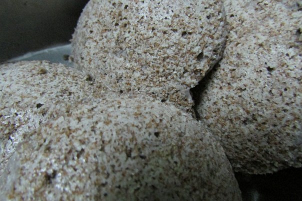 Idlis made of teff and urad. The idlis rise and taste good, but the texture is on the dense side.